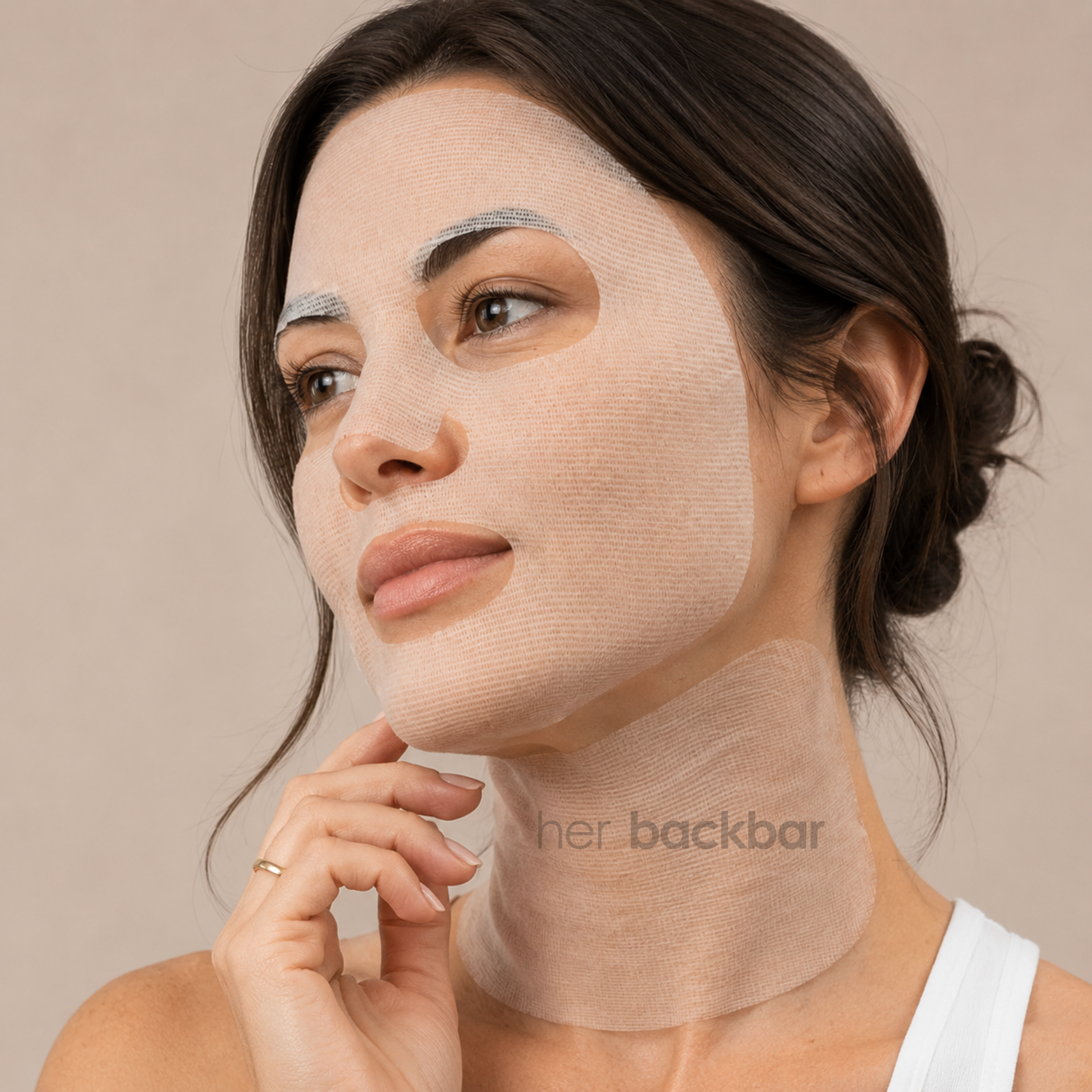 Woman wearing Dermathod Revive Triple Action Mask on the face and neck for hydrating skincare treatment